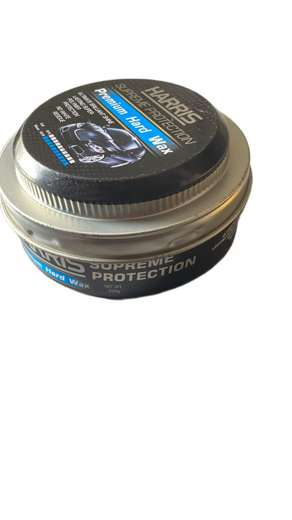 Round metal tin of Harris Premium Hard Wax for cars with black and blue label showing a shiny car