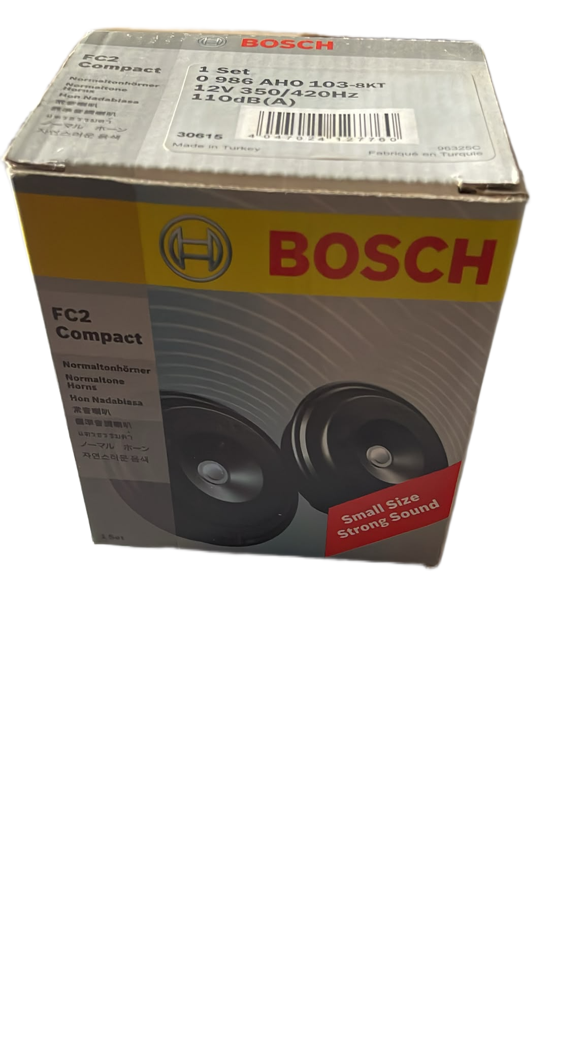 Bosch FC2 Compact car speaker retail box, showing the brand name in red on a yellow band and a photo of two black speakers on the front.